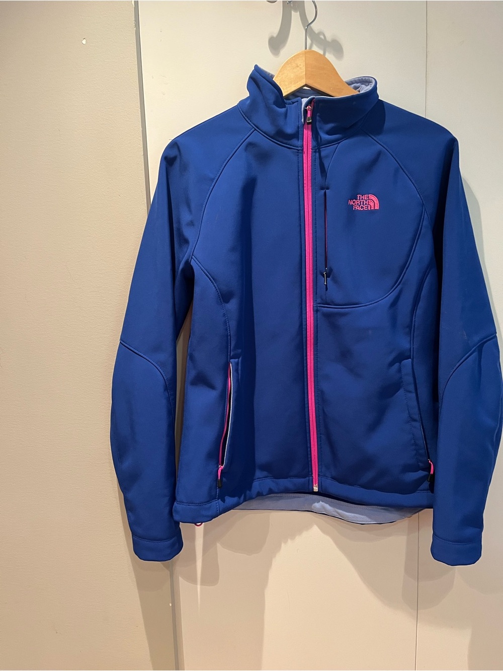 The North Face women’s Blue Rashguard with Pink Zip Accents